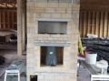 masonry heater kit with 65# firebox, firebrick channels, white oven, and front heated bench