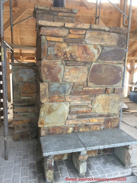 Coldwaters-Large-masonry-heater-finished-with-sandstone-by-Finland-MN