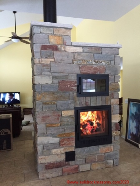 SR-22-see-through-masonry-heater-finished-with-Chilton-limestone-in-Indiana