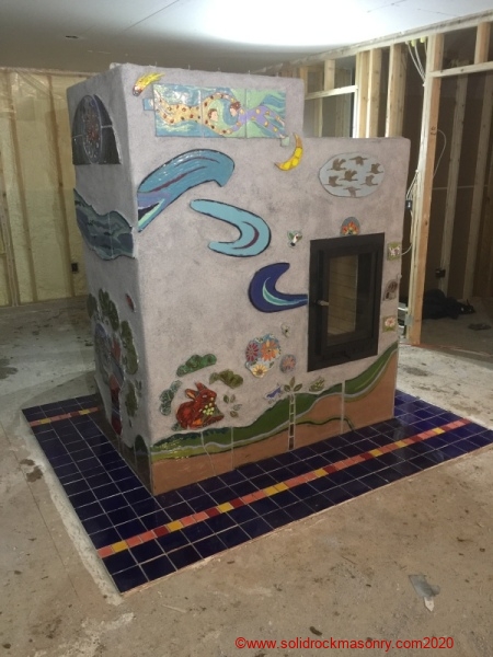 Custom-tile-and-stucco-small-room-masonry-heater