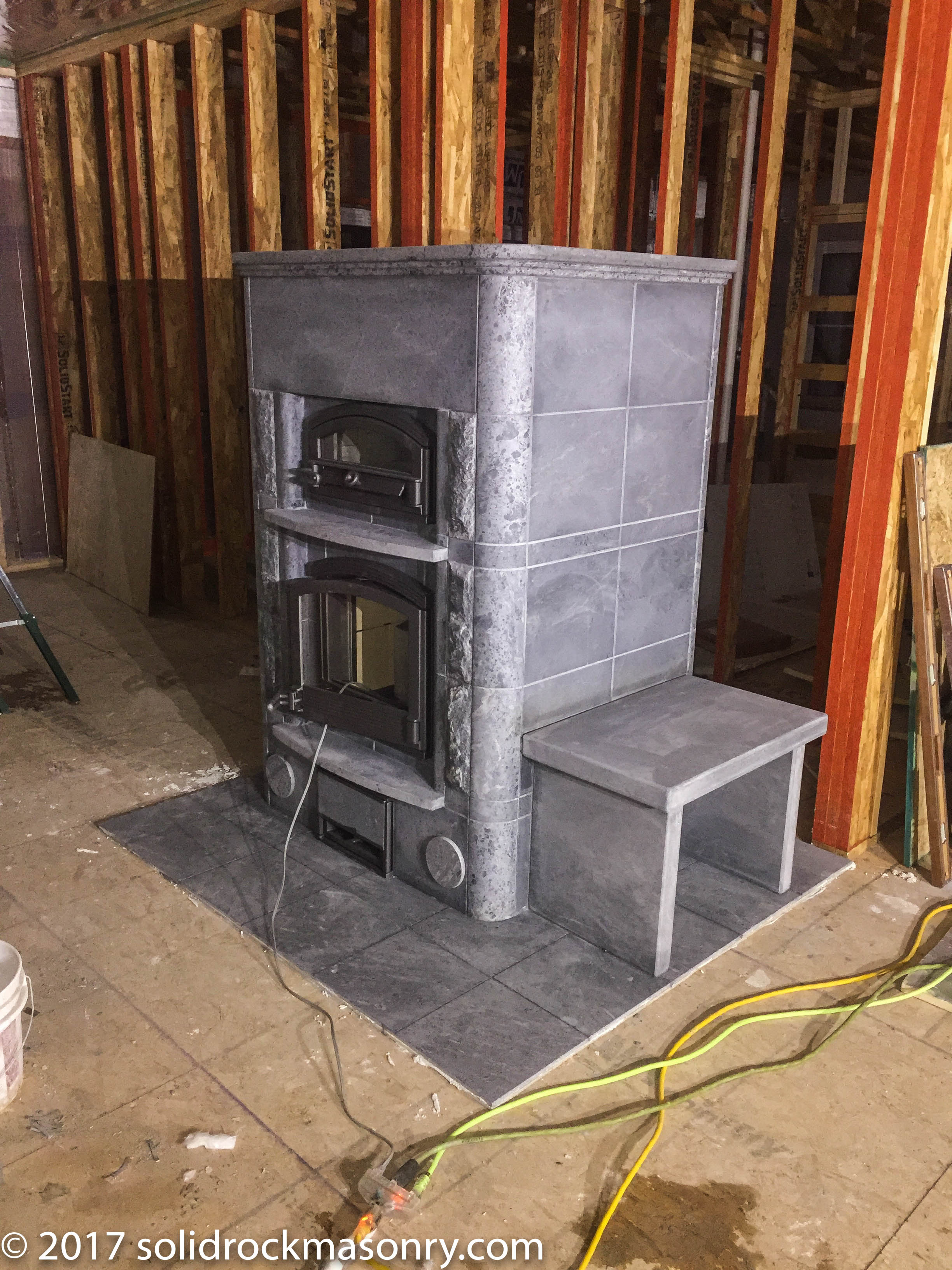Sweazy Tulikivi TLU2450 with a custom side bench | Solid Rock Masonry
