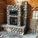 stone built fireplace for a stove and oven